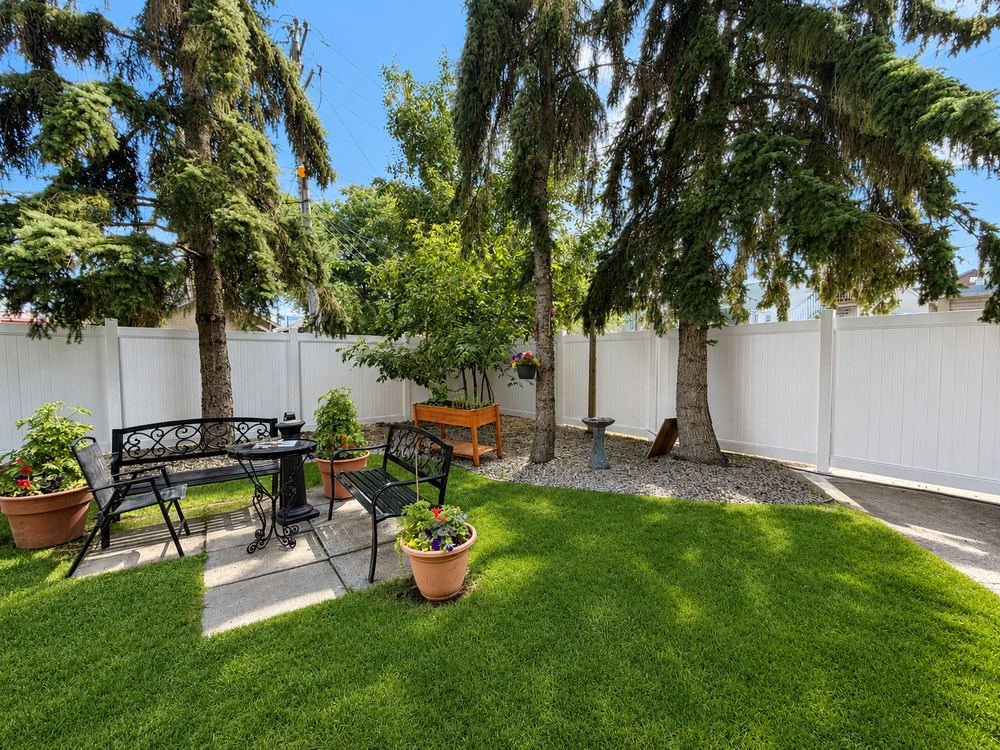 Landscaped courtyard with privacy fence
