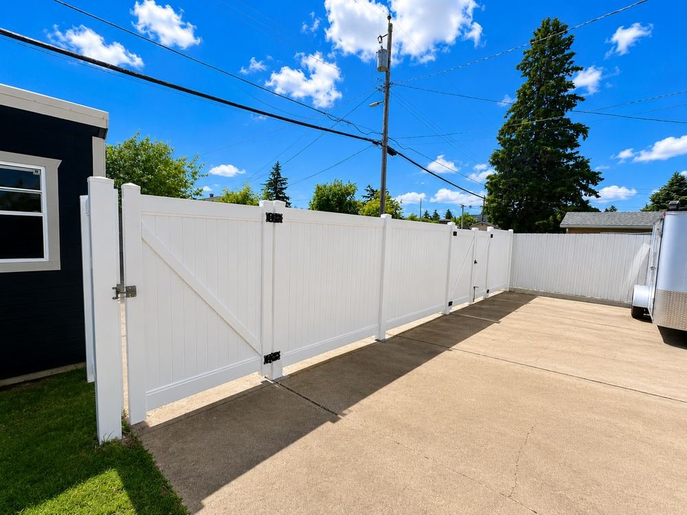 Fence and gate along driveway